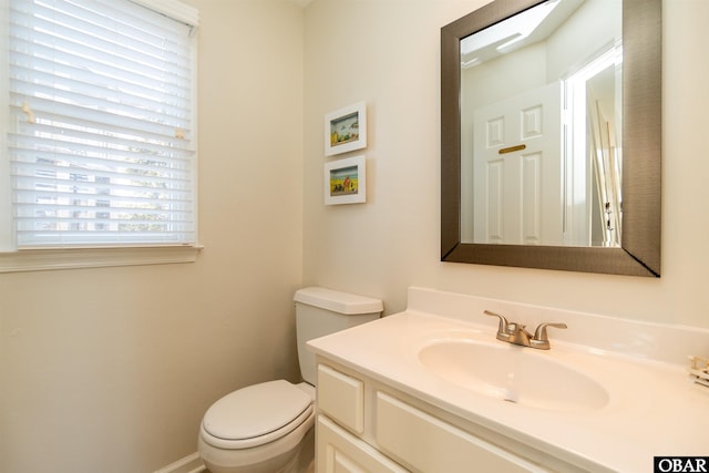 half bath with vanity and toilet