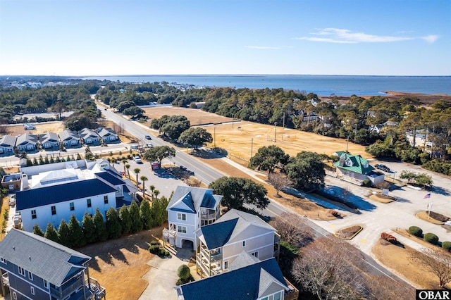 birds eye view of property featuring a water view and a residential view