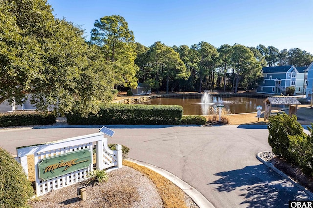 surrounding community featuring a water view