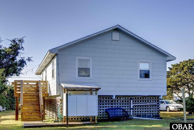 view of side of home with stairs