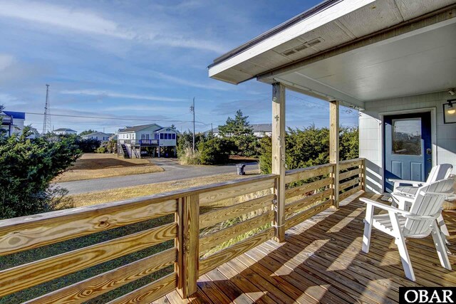 wooden terrace featuring a porch