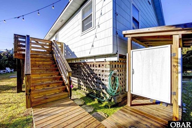 wooden deck featuring stairway