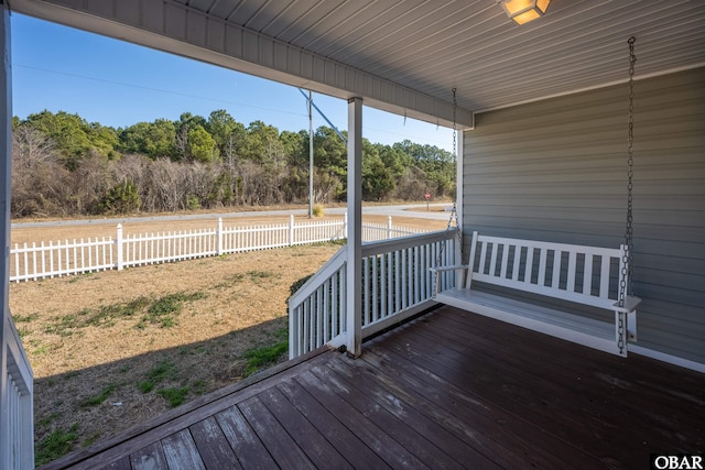 wooden deck featuring fence