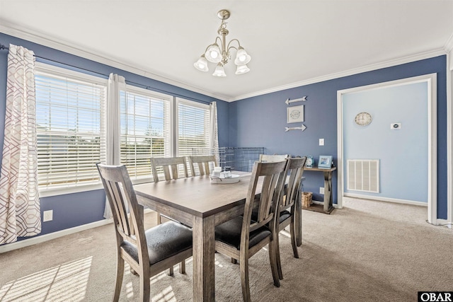 dining room featuring ornamental molding, light colored carpet, and visible vents