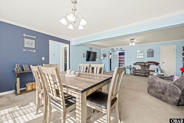 dining space featuring baseboards, ornamental molding, and light colored carpet