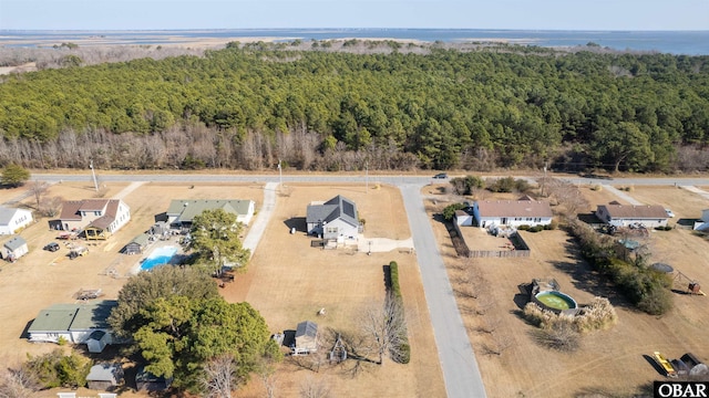 birds eye view of property with a wooded view