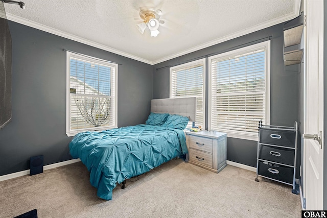 bedroom featuring crown molding, baseboards, and light colored carpet