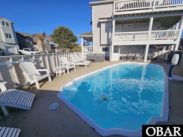 view of pool featuring a fenced in pool and a patio