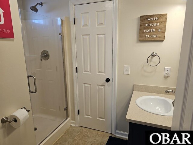 full bath with a shower stall and vanity