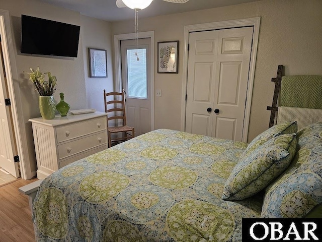 bedroom featuring a closet and wood finished floors