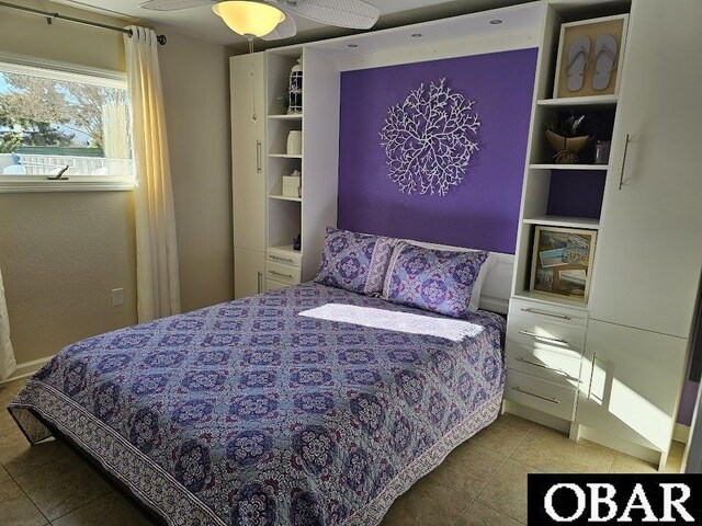 tiled bedroom with ceiling fan