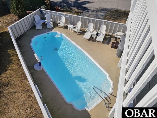 view of pool featuring a patio area