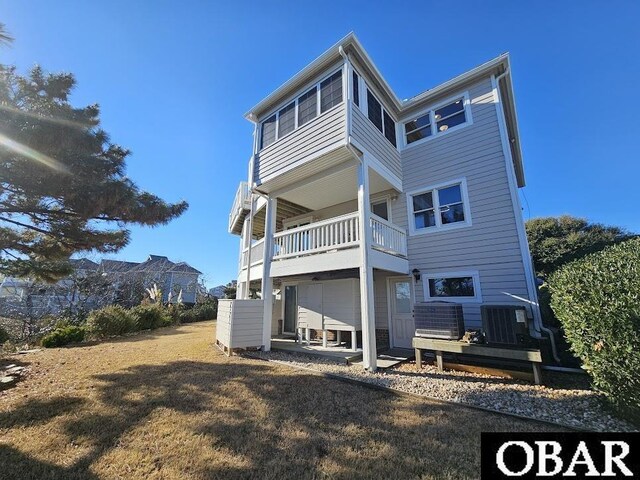 rear view of property with central AC, a patio area, and a balcony