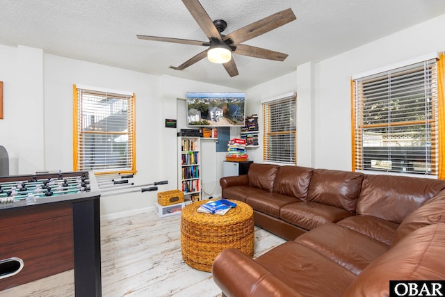 761 Bayberry Ct Lot 119, Corolla, NC 27927 - living area with a ceiling fan, wood finished floors, lofted ceiling, a textured ceiling, and baseboards