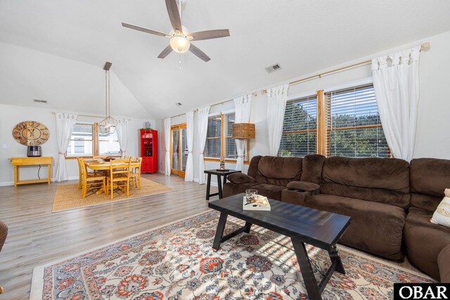 761 Bayberry Ct Lot 119, Corolla, NC 27927 - living area featuring a ceiling fan, light wood finished floors, baseboards, and vaulted ceiling