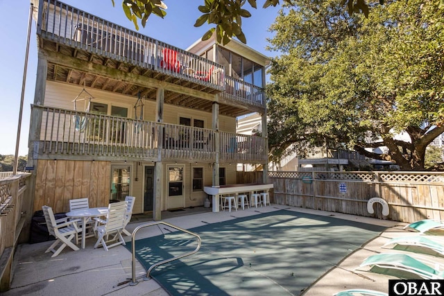 761 Bayberry Ct Lot 119, Corolla, NC 27927 - back of house with a patio, fence, and a balcony