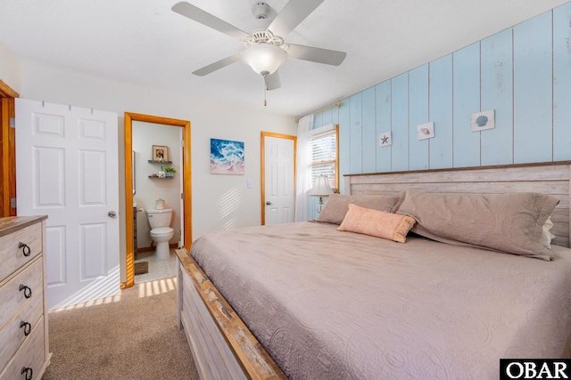 761 Bayberry Ct Lot 119, Corolla, NC 27927 - carpeted bedroom featuring connected bathroom, ceiling fan, and baseboards