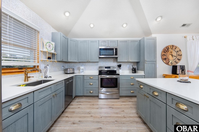 761 Bayberry Ct Lot 119, Corolla, NC 27927 - kitchen with stainless steel appliances, a sink, light countertops, decorative backsplash, and lofted ceiling