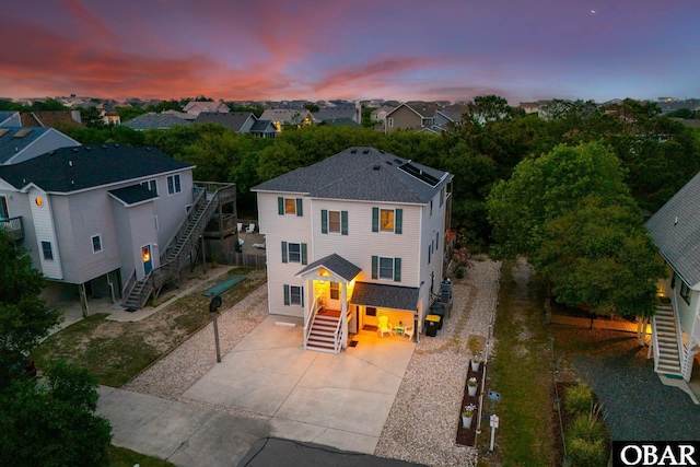 761 Bayberry Ct Lot 119, Corolla, NC 27927 - view of front facade featuring stairs, driveway, and a residential view