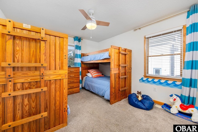 761 Bayberry Ct Lot 119, Corolla, NC 27927 - bedroom with carpet flooring, a textured ceiling, and a ceiling fan