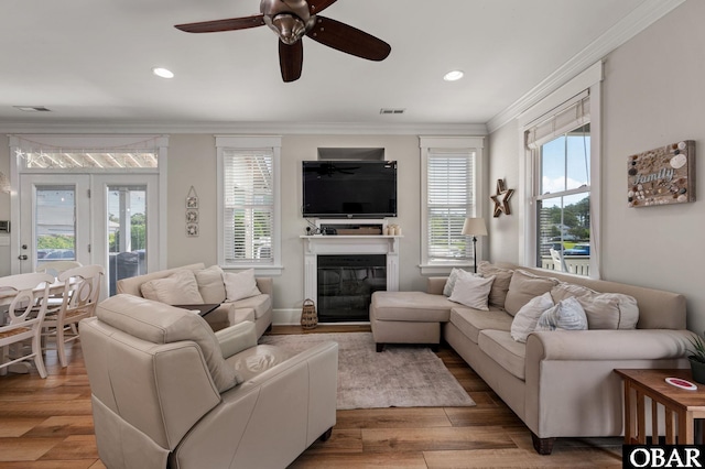 509 Cypress Ln Lot # 1, Manteo, NC 27954 - living area with crown molding, ceiling fan, a glass covered fireplace, light wood-type flooring, and recessed lighting