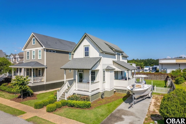 509 Cypress Ln Lot # 1, Manteo, NC 27954 - view of front of property with a porch, roof with shingles, asphalt driveway, and board and batten siding
