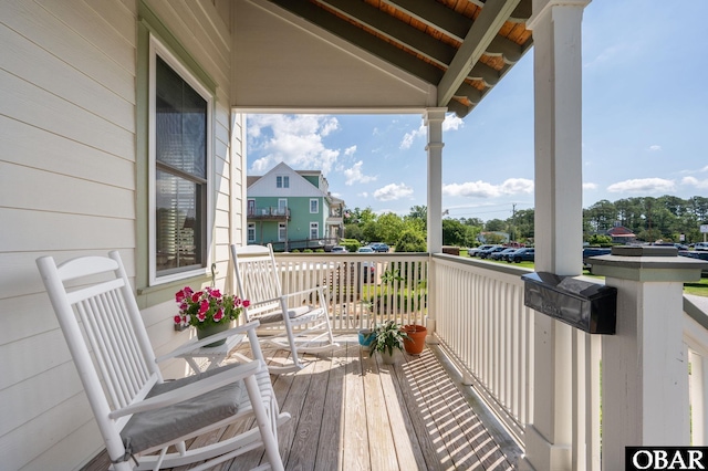 wooden deck featuring a porch