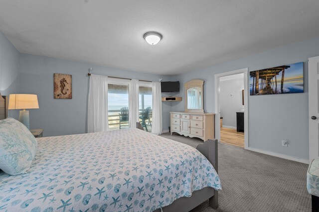 bedroom with baseboards and light colored carpet