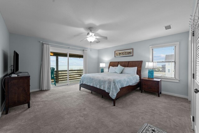 bedroom featuring visible vents, a ceiling fan, light carpet, access to outside, and baseboards