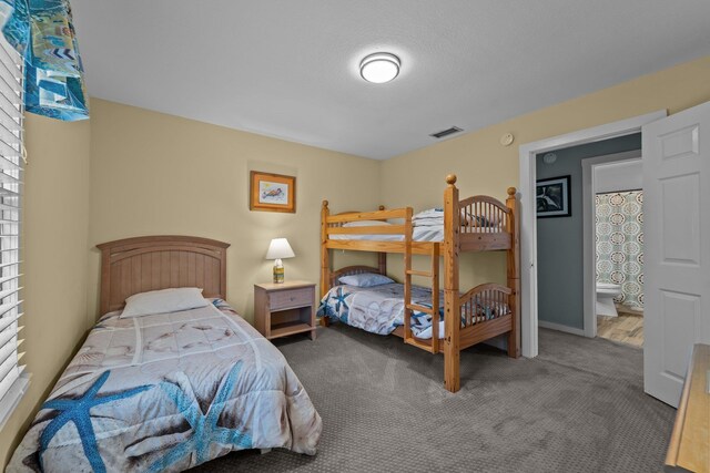 carpeted bedroom with visible vents