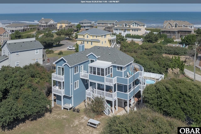 bird's eye view featuring a residential view and a water view