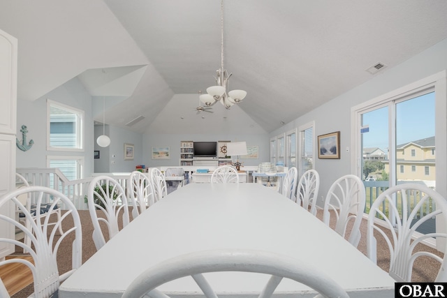 dining room featuring visible vents, lofted ceiling, and an inviting chandelier