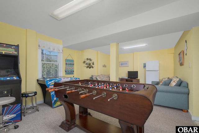 recreation room featuring carpet and baseboards