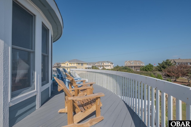 wooden terrace with a residential view