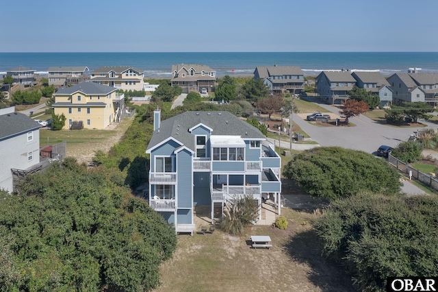 bird's eye view with a residential view and a water view