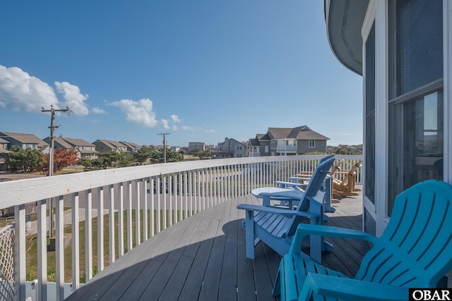 wooden deck with a residential view