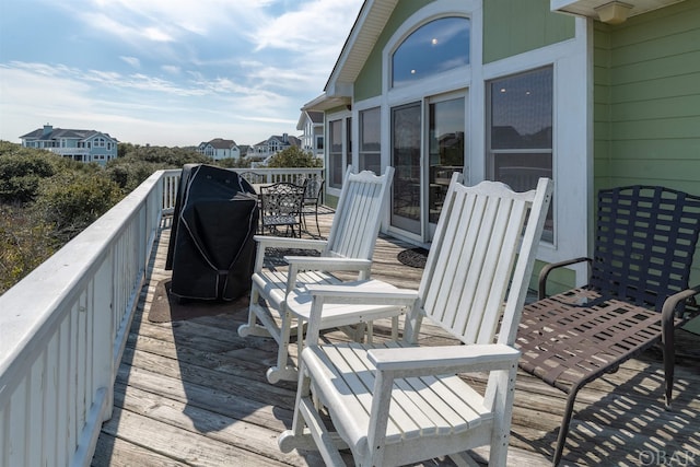 wooden deck with a residential view