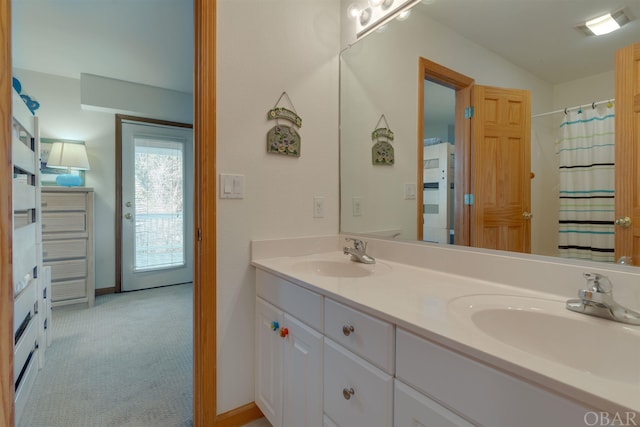 full bathroom featuring double vanity, a sink, and a shower with curtain