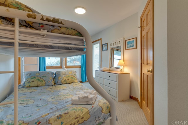 bedroom featuring light colored carpet