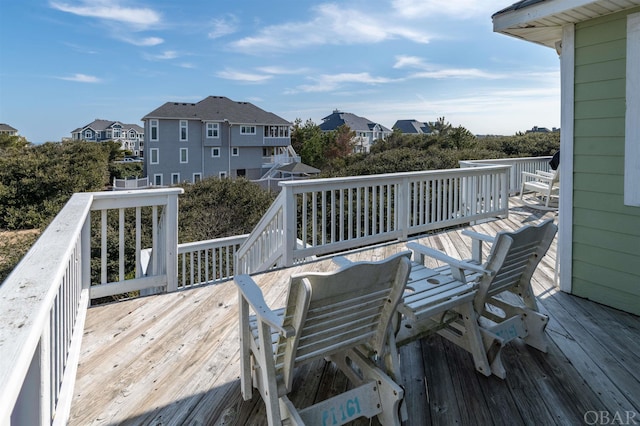 wooden deck featuring a residential view