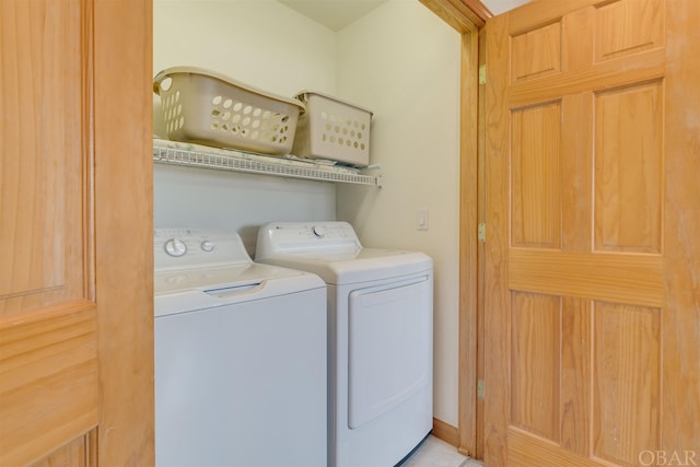 washroom featuring laundry area and washing machine and dryer