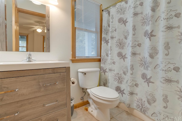 full bathroom featuring a shower with shower curtain, toilet, a ceiling fan, vanity, and tile patterned floors