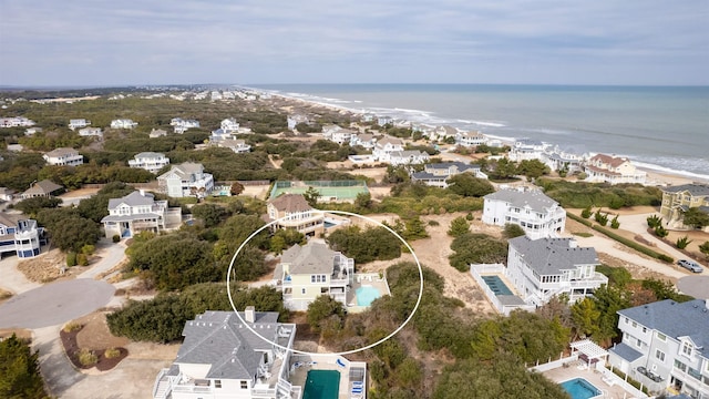 birds eye view of property featuring a water view and a residential view