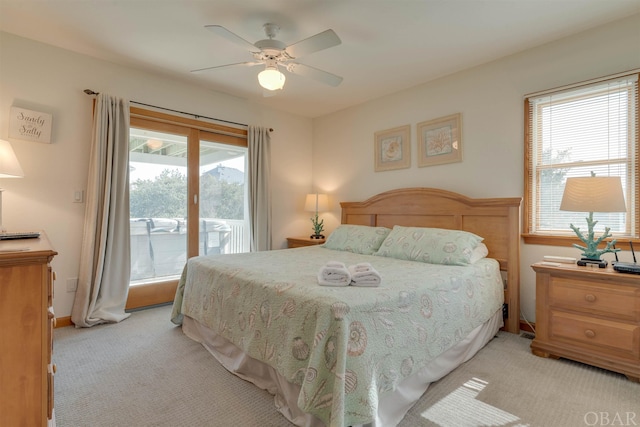 bedroom with light carpet, access to outside, and a ceiling fan