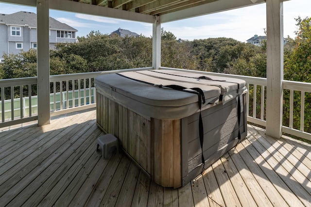 deck featuring a hot tub