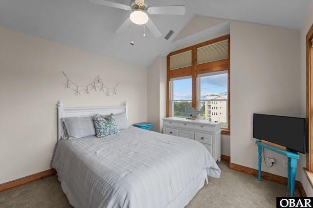 bedroom featuring light carpet, baseboards, visible vents, and vaulted ceiling