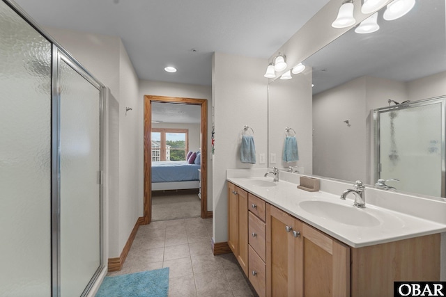 ensuite bathroom with a sink, a shower stall, and ensuite bathroom