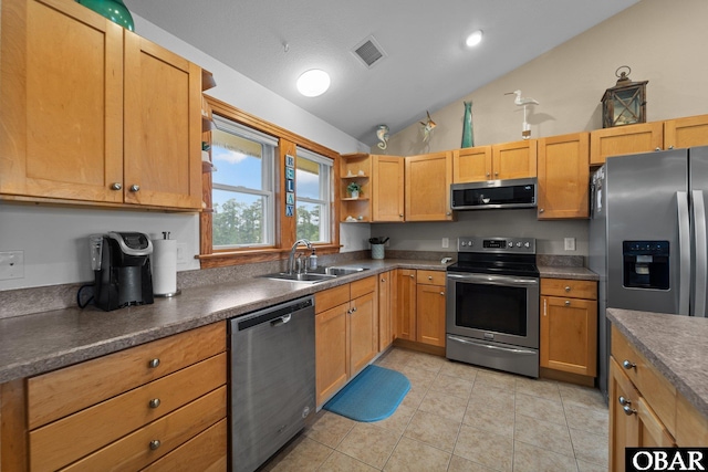 kitchen featuring open shelves, stainless steel appliances, dark countertops, visible vents, and a sink