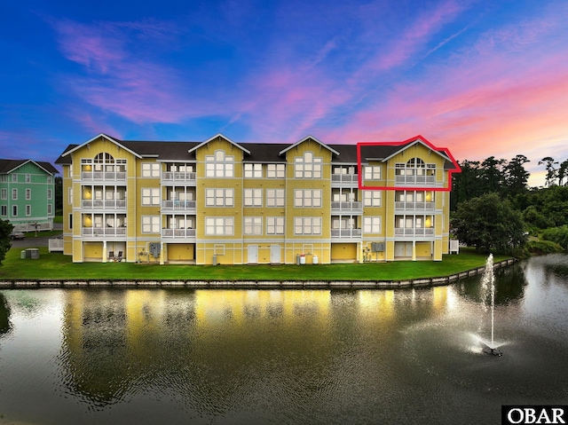 view of building exterior with a water view