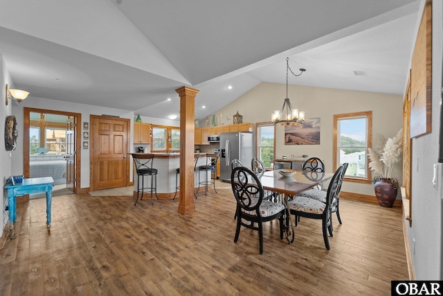 dining area featuring decorative columns, baseboards, wood finished floors, and recessed lighting